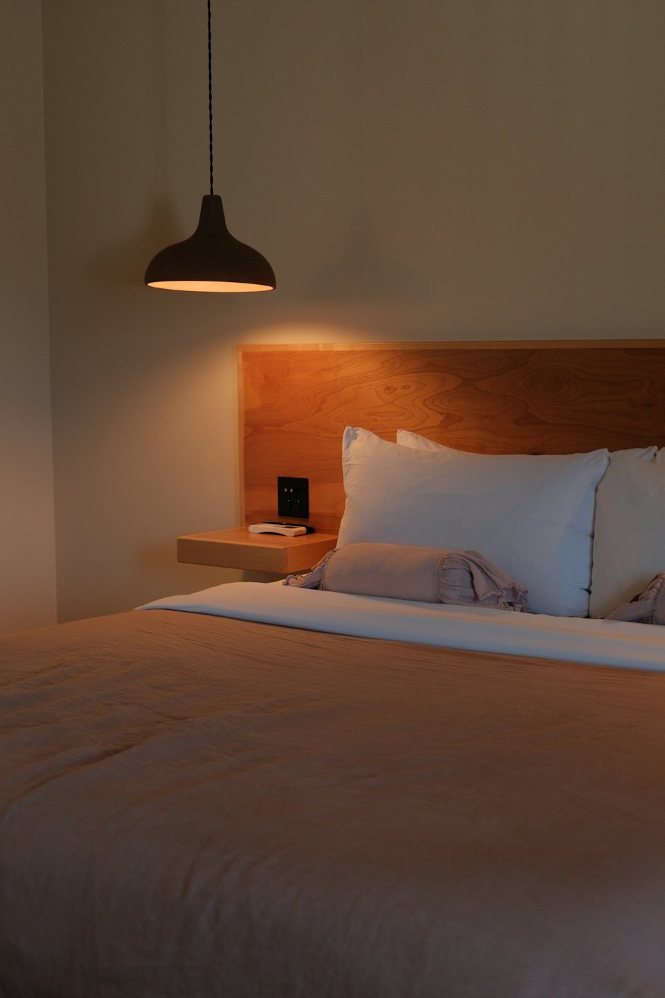 A calm, neatly made bedroom.